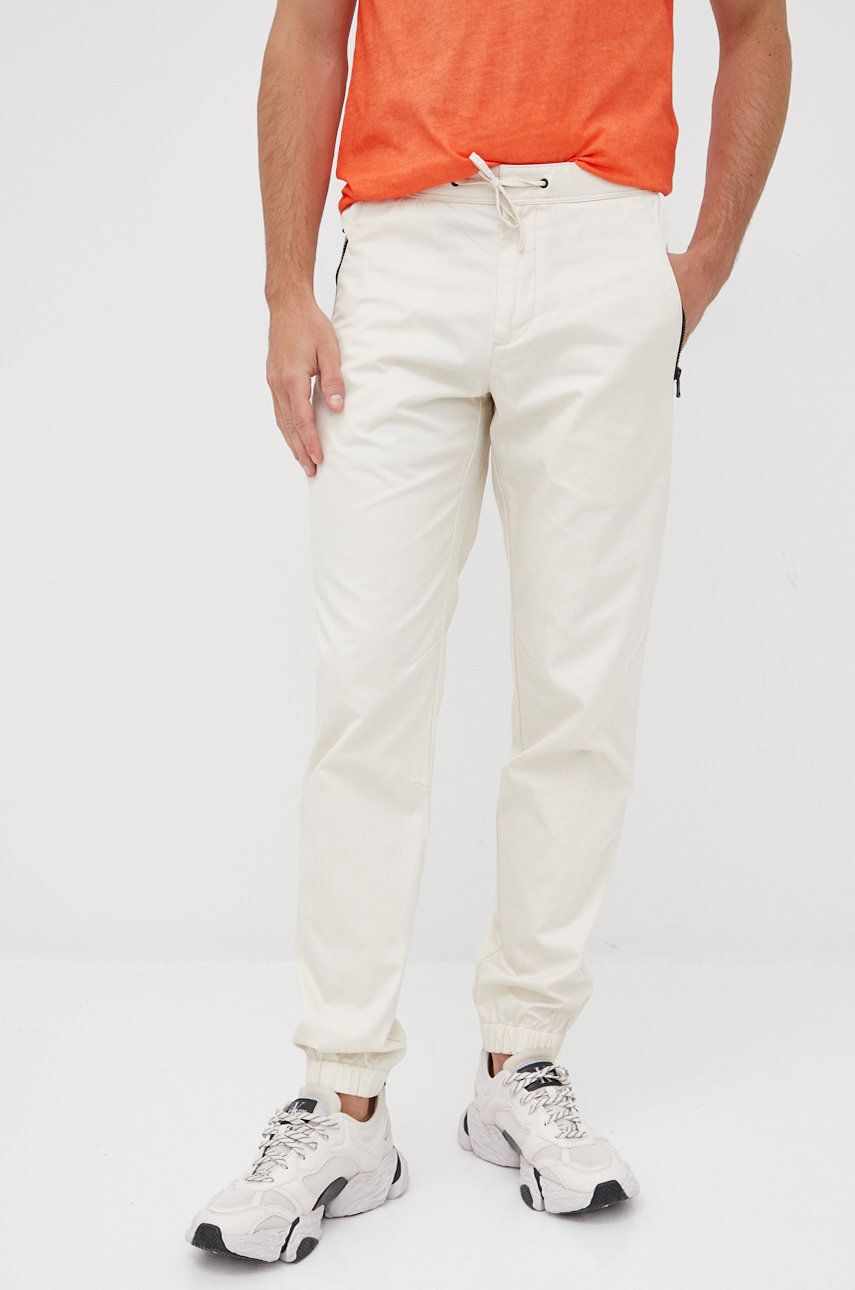 Sisley pantaloni de bumbac barbati, culoarea bej, jogger